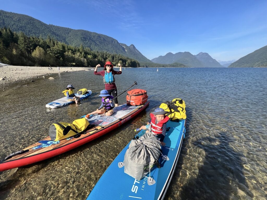 Loading the paddleboards for camping with kids