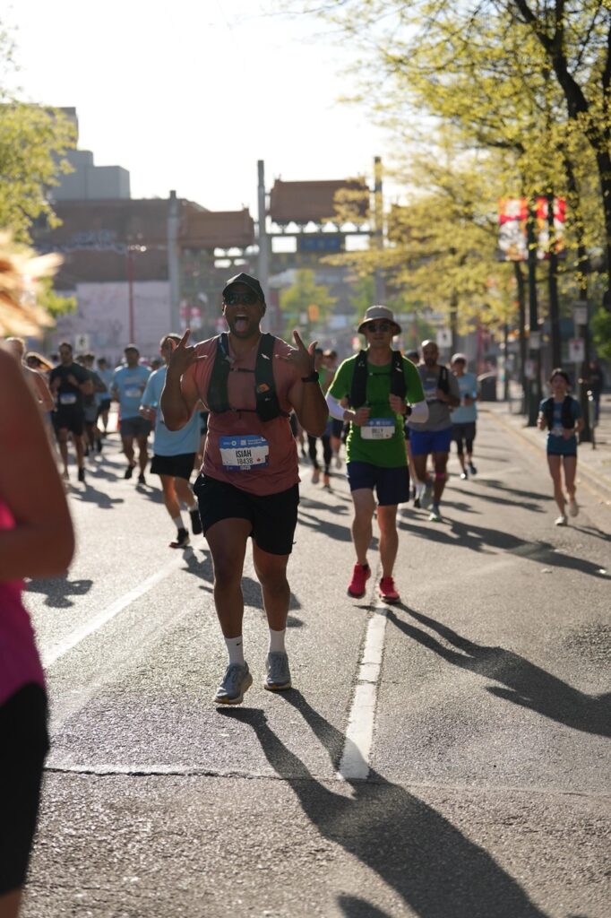 Runners passing through Vancouver Chinatown during the BMO Vancouver Half Marathon