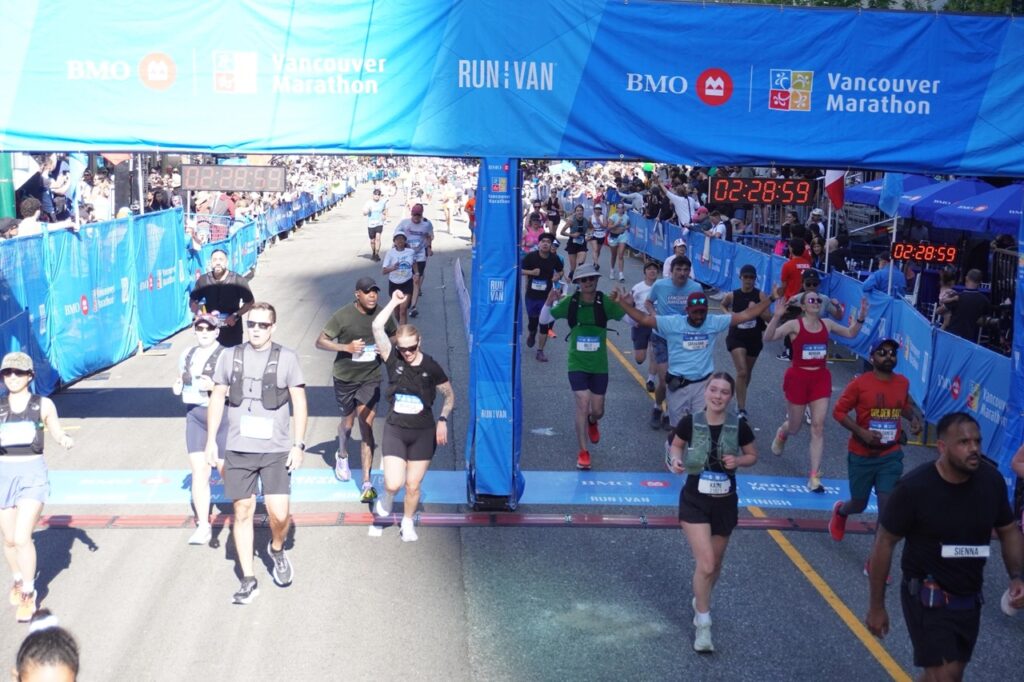 Runner approaching the real finish line at the BMO Vancouver Half Marathon 2026